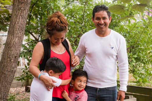 a father and mother with their kids