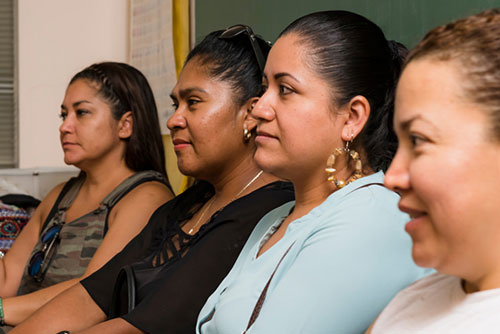 group of women listening to a session
