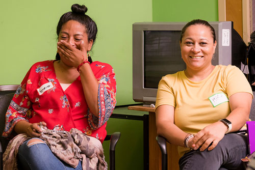 group of women listening to a session
