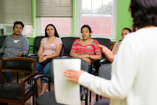 group of women listening to a session